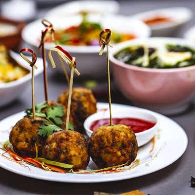 side-view-chicken-meatballs-with-greens-ketchup-plate-min (1)